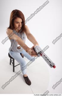 23 2020 MOLLY SITTING POSE WITH GUN